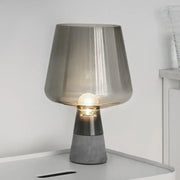Modern gray glass and concrete table lamp with translucent shade and metallic accent band for bedroom decorbites leimu amber use