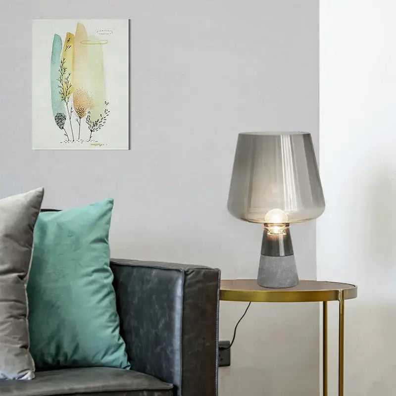 A modern table lamp with leimu amber glass shade and textured concrete base for bedroom decorbites leimu amber decor