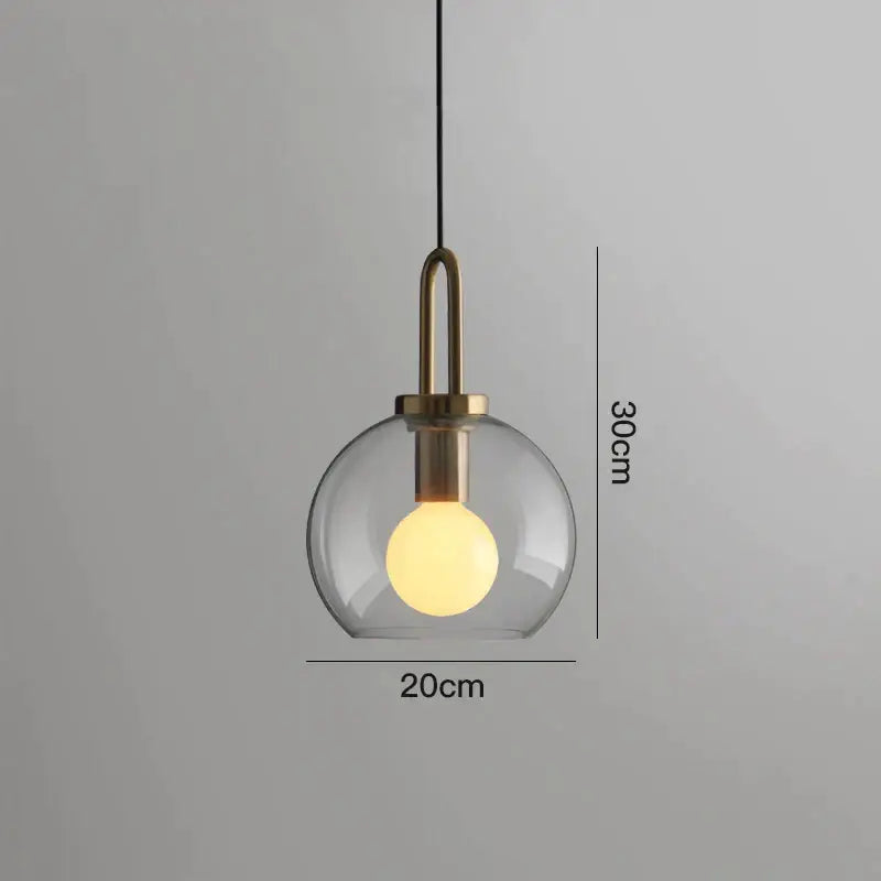 Modern gray glass ball pendant lights with brass metal hardware and exposed warm bulb for dining room decorbites glass ball pendant