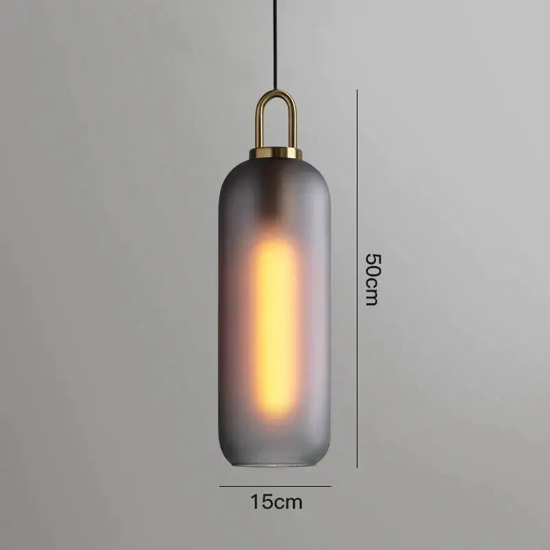 A sleek 50cm gray glass ball pendant light with frosted glass and brass accents for modern dining room decorbites pendant lights