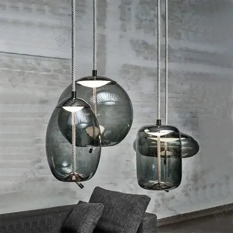 Modern gray glass chandelier knot pendant lamp with sleek organic shapes and metallic rope cords for dining room lighting