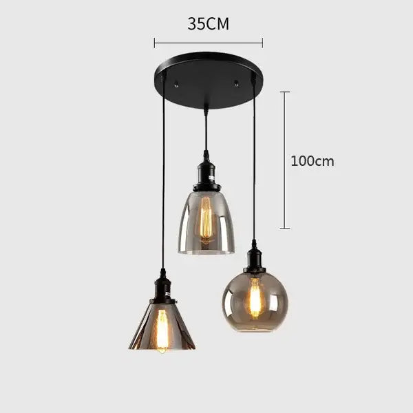 Modern gray glass pendant light set of 4 with industrial-style black metal frames and three distinct glass shades for dining room lighting