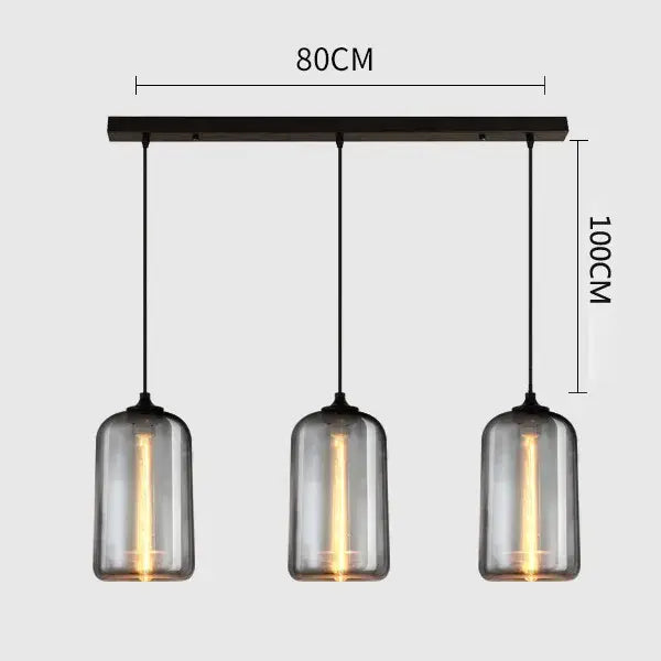 Modern gray glass pendant light set of 4 with three smoked cylindrical shades and dark metal bar for dining room lighting