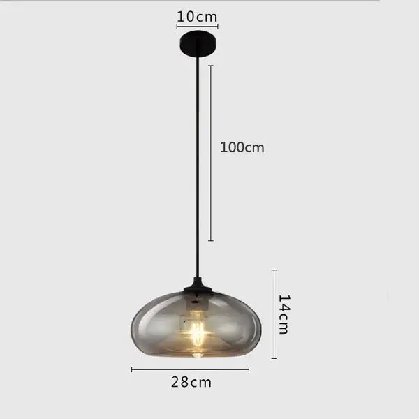 A sleek modern gray glass pendant light with smoked glass globe and black metal hardware for dining room lighting