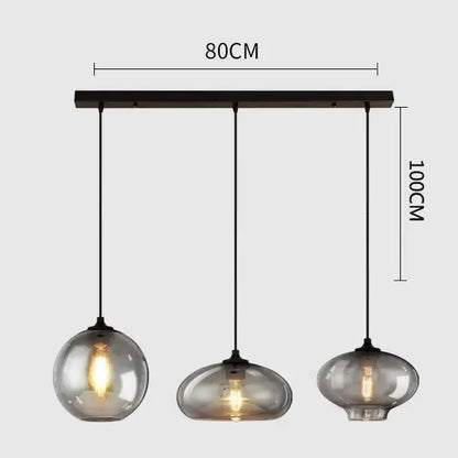 Modern pendant light set of 4 with gray glass smoked globes and black metal hardware for dining room lighting
