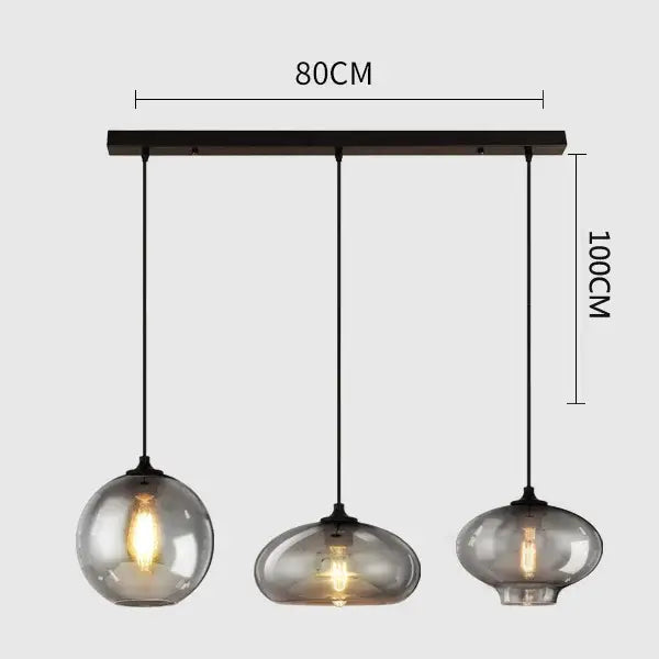 Modern pendant light set of 4 with gray glass smoked globes and black metal hardware for dining room lighting