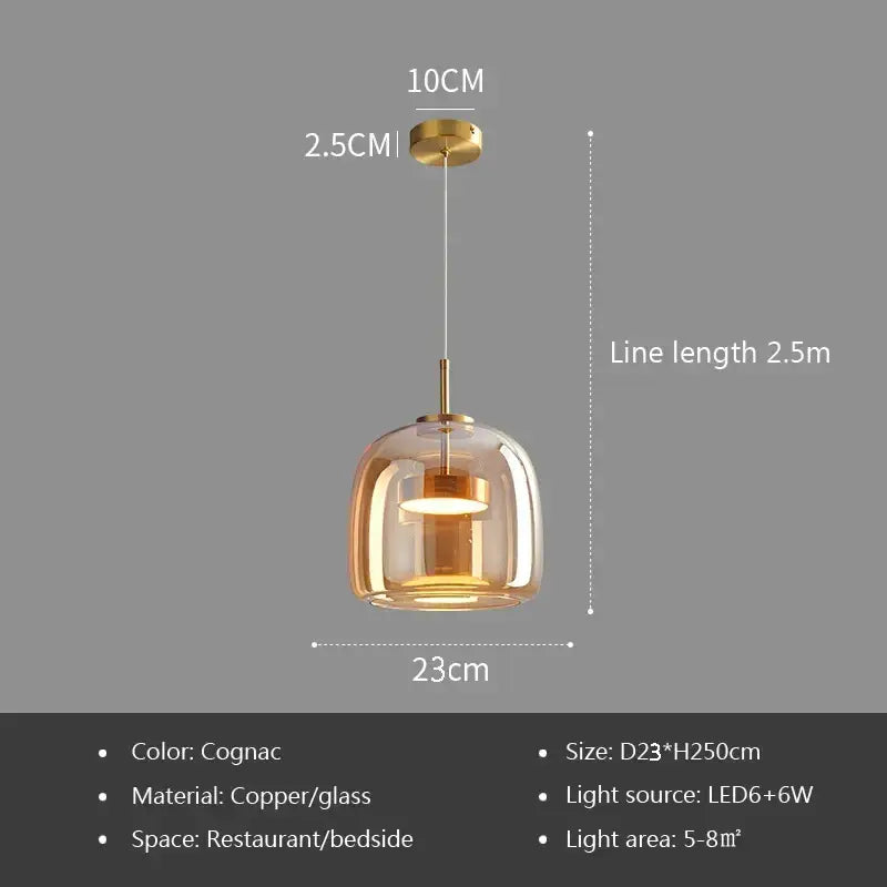 Modern gray glass pendant light with plated detailing featuring cognac-colored glass and copper finish for kitchen use