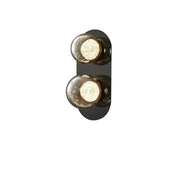 Modern black wall sconce with two spherical textured glass bulbs featuring warm interior lighting for living room wall lights