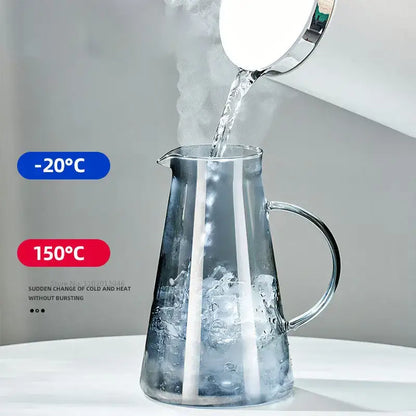 Modern gray glass water pitcher with sleek design sturdy handle and stainless steel lid for kitchen use