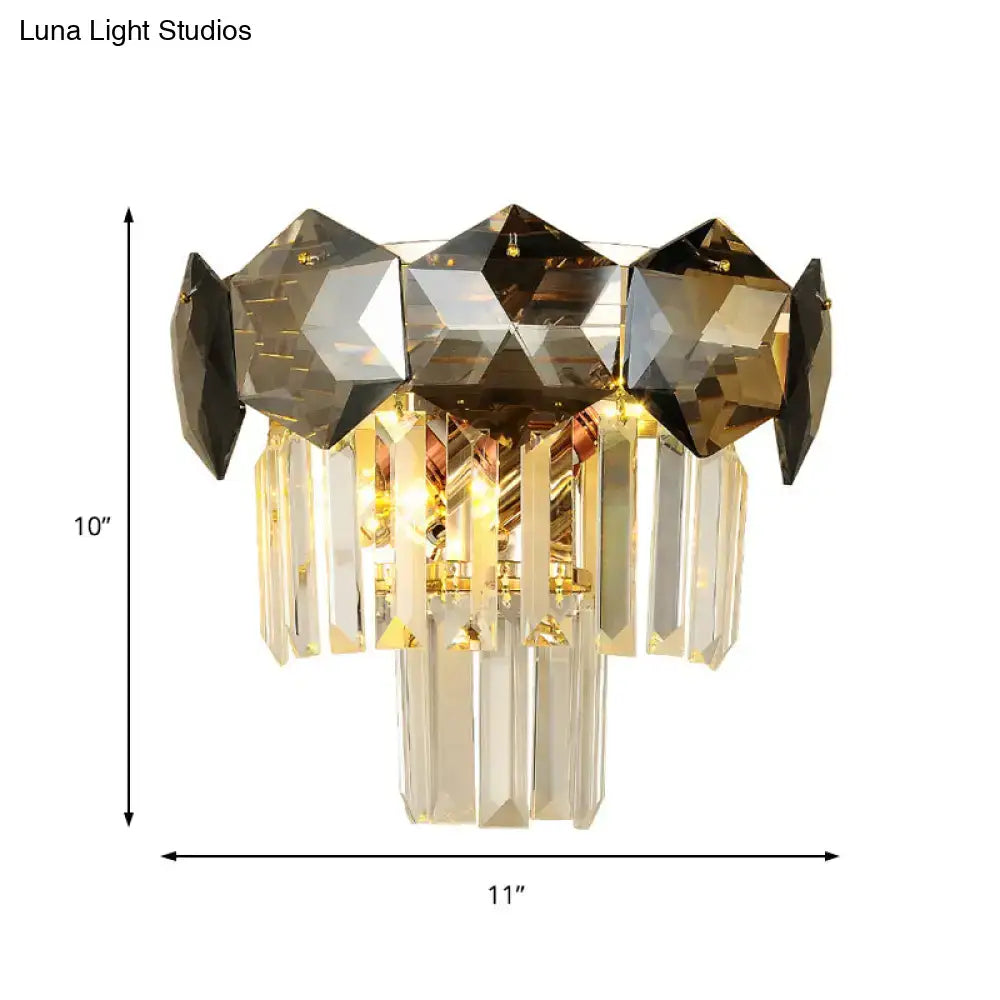 Luxurious gold-toned wall light fixture with faceted amber and clear crystals for modern restaurant wall lamp designs