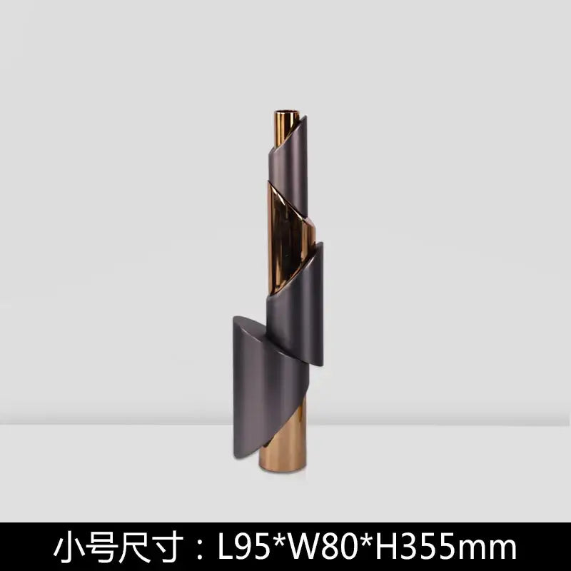 Modern gray and gold metallic candle holder with interlocking helical pipe design for dining room decorbites geometric decor
