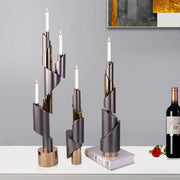 Modern gray and gold helical pipe candle holder with sleek twisted design for dining room decorbites geometric decor