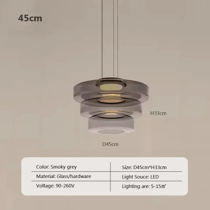 Modern gray and green tiered glass pendant light with smoky grey glass and led illumination for dining room