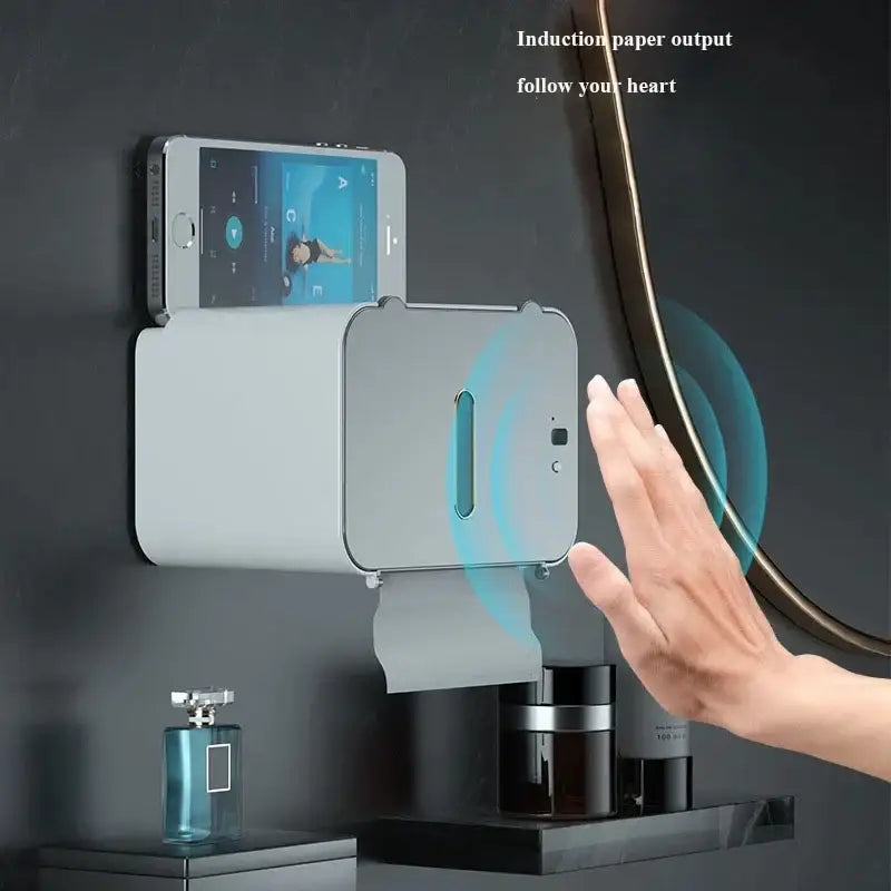 Modern gray wall-mounted induction toilet paper holder with sleek metallic edges and minimalist bathroom design