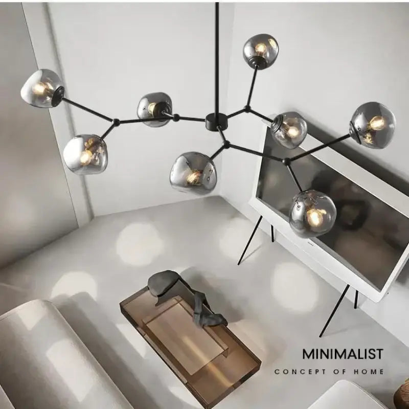 Modern gray lava glass chandelier featuring black metal frame with spherical smoked glass shades for dining room lighting