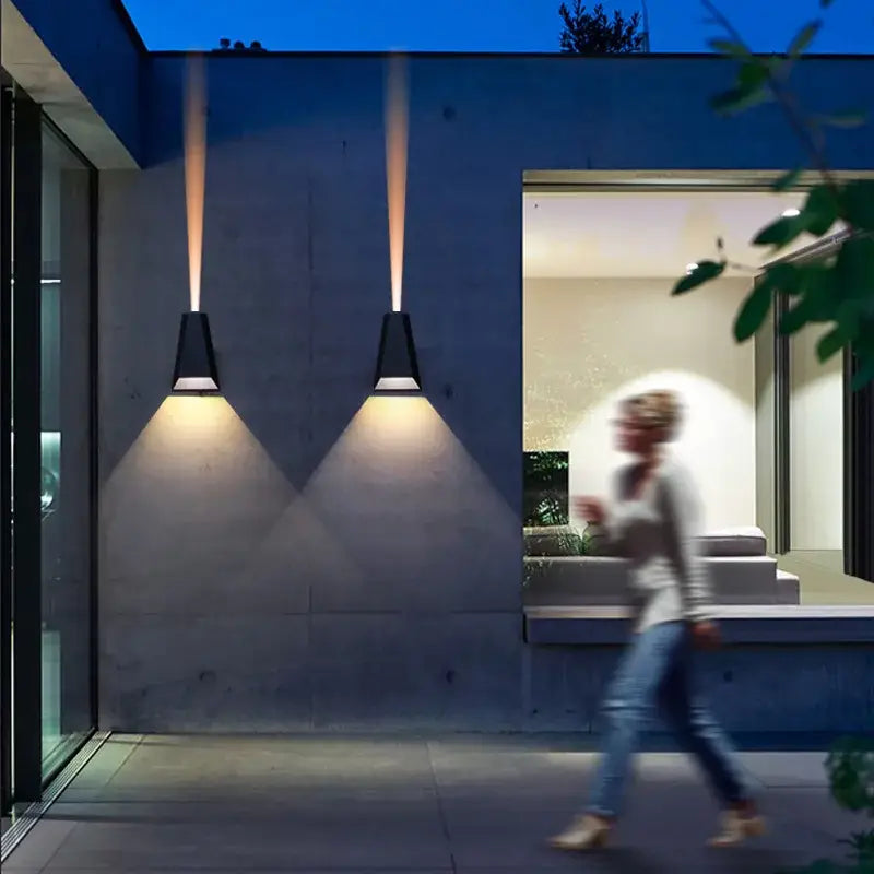 Modern gray led wall washer outdoor sconce with black conical spotlights illuminating concrete exterior for garden decorbites led wall