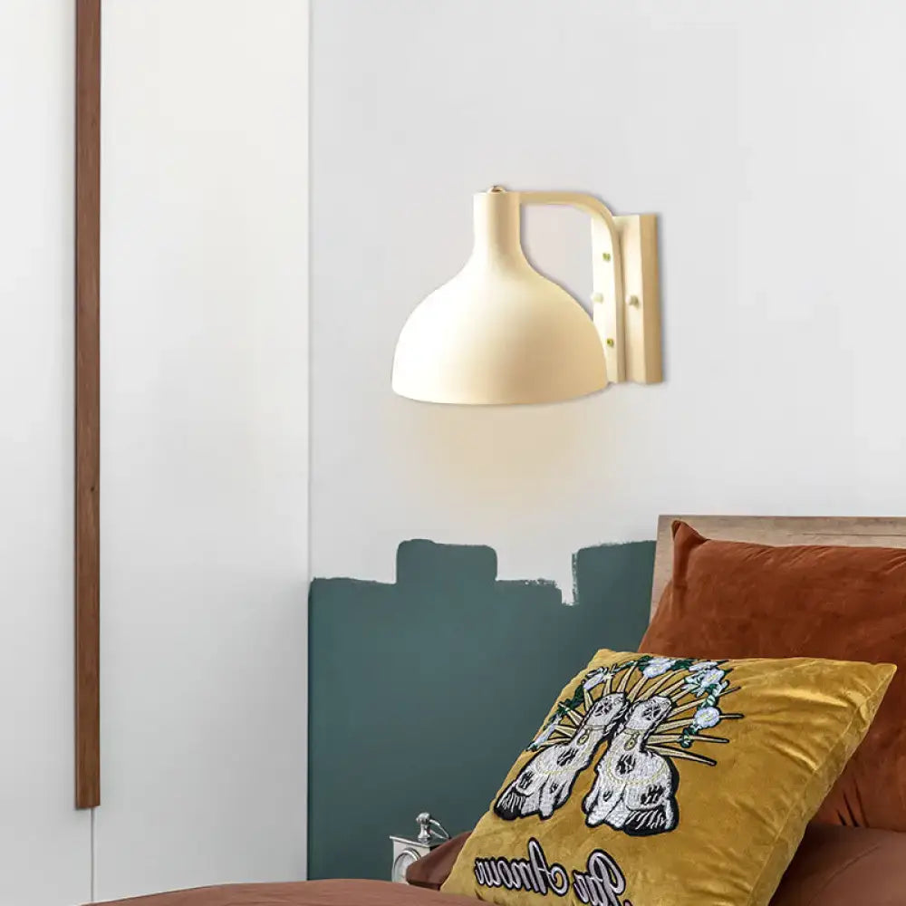 Modern gray metal domed wall sconce with cream-colored rounded bell shade and minimalist bracket for hallway lighting