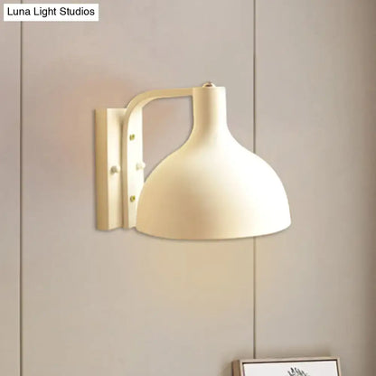 Modern gray metal domed wall sconce with cream-colored rounded shade and sleek bracket for adjustable hallway lighting