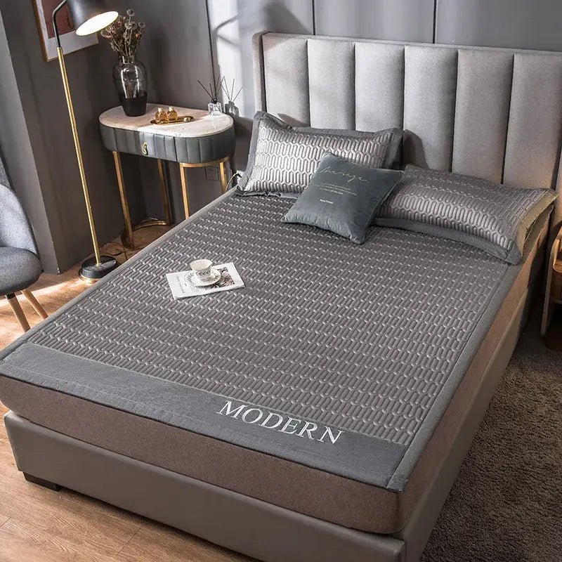 Modern gray quilted cooling latex bed mat with embroidered modern lettering for bedroom use