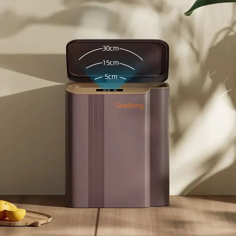 A sleek modern gray smart sensor trash can with matte taupe finish and dark brown lid for kitchen and bathroom use