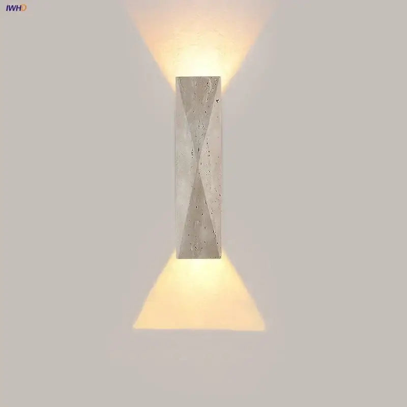 Modern gray stone double led wall lamp with textured concrete design casting warm light for bedroom use