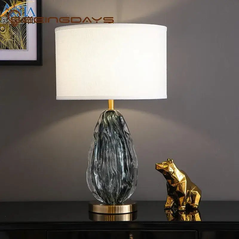 Modern gray swirl crystal table lamp with translucent glass base and gold accents for bedroom night light decorbites crystal table