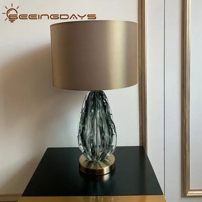 Modern gray swirl crystal table lamp with a dark gray textured glass body and gold-toned base for bedroom decorbites crystal table use