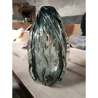 Modern gray swirl crystal table lamp with a translucent green glass vase featuring leaf design and ridged edges decorbites crystal table lamp