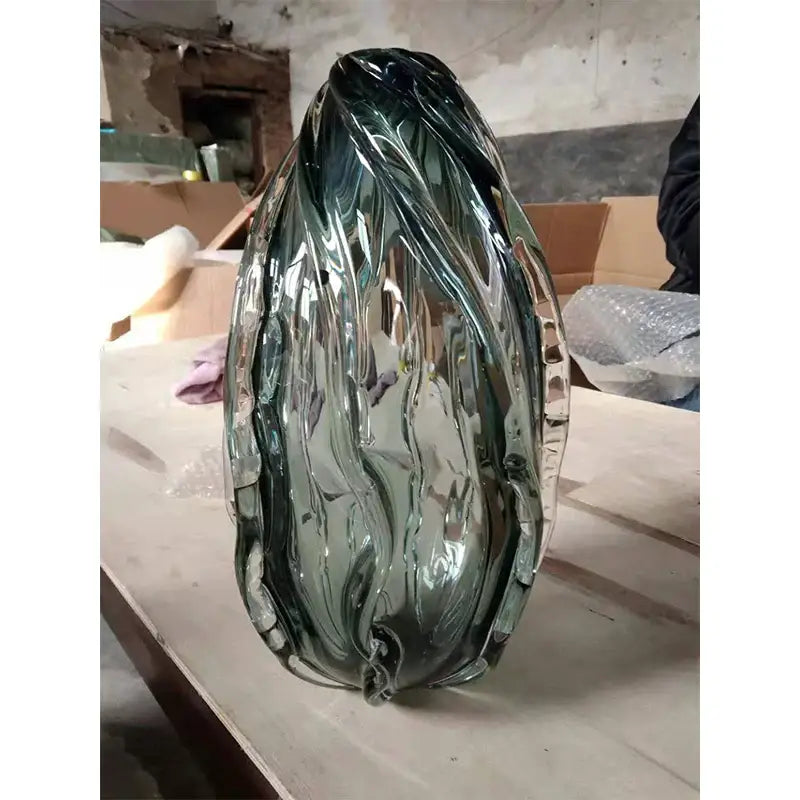 Modern gray swirl crystal table lamp with a translucent green glass vase featuring leaf design and ridged edges decorbites crystal table lamp