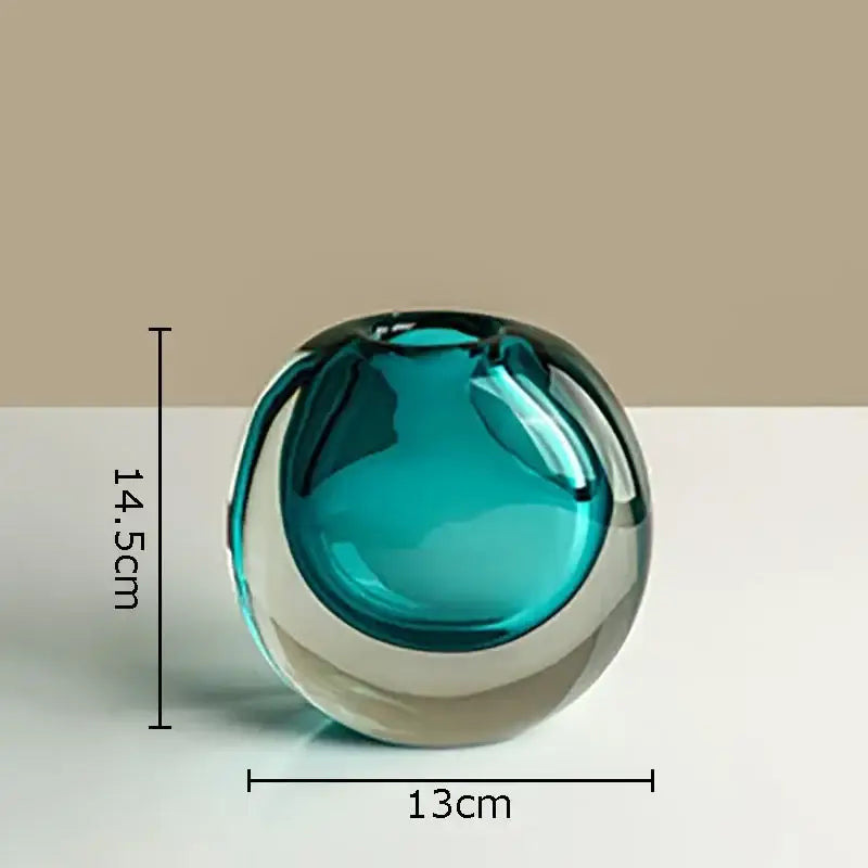 Modern gray and teal translucent glass vase with clear base featuring artificial flowers for stylish home decor