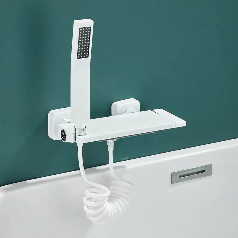 Modern gray wall mounted waterfall faucet set with white handheld spray head and integrated shelf for bathroom shower