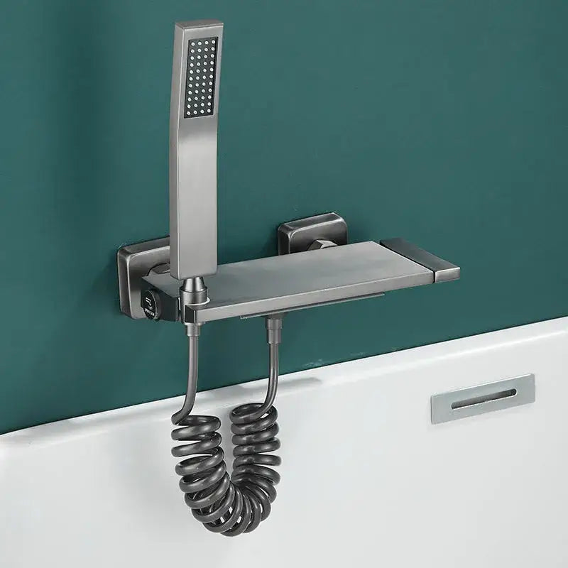 Modern gray wall mounted waterfall faucet set with brushed nickel finish integrated shelf and coiled hose for bathroom shower