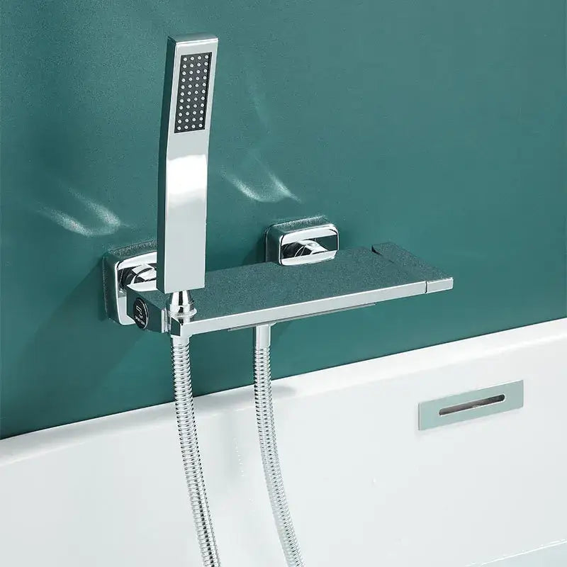 Modern gray wall mounted faucet set with chrome finish handheld spray head and integrated shelf for bathroom shower