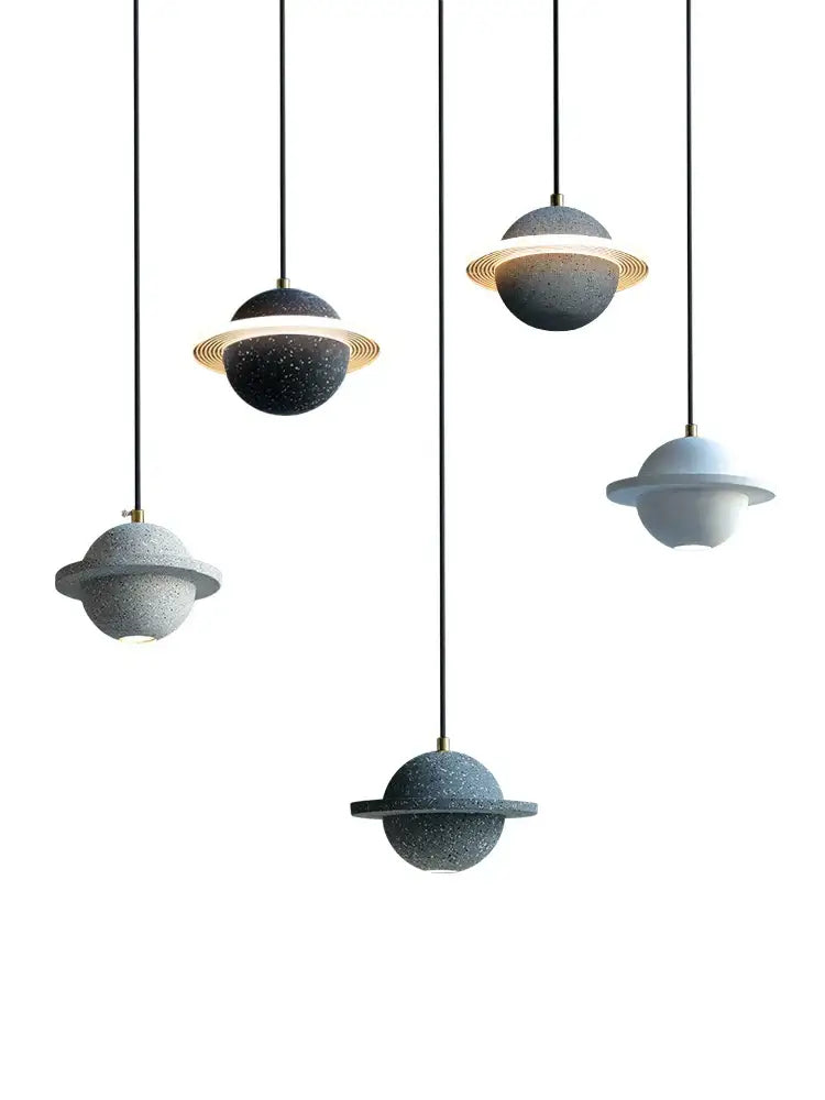 Modern gray and white cement planet pendant light with glowing golden ring for bedroom decorbites cement planet decor