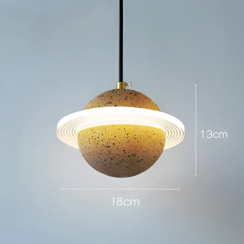 Modern gray and white cement planet pendant light with speckled earthy body and glowing ring for bedroom decorbites pendant light