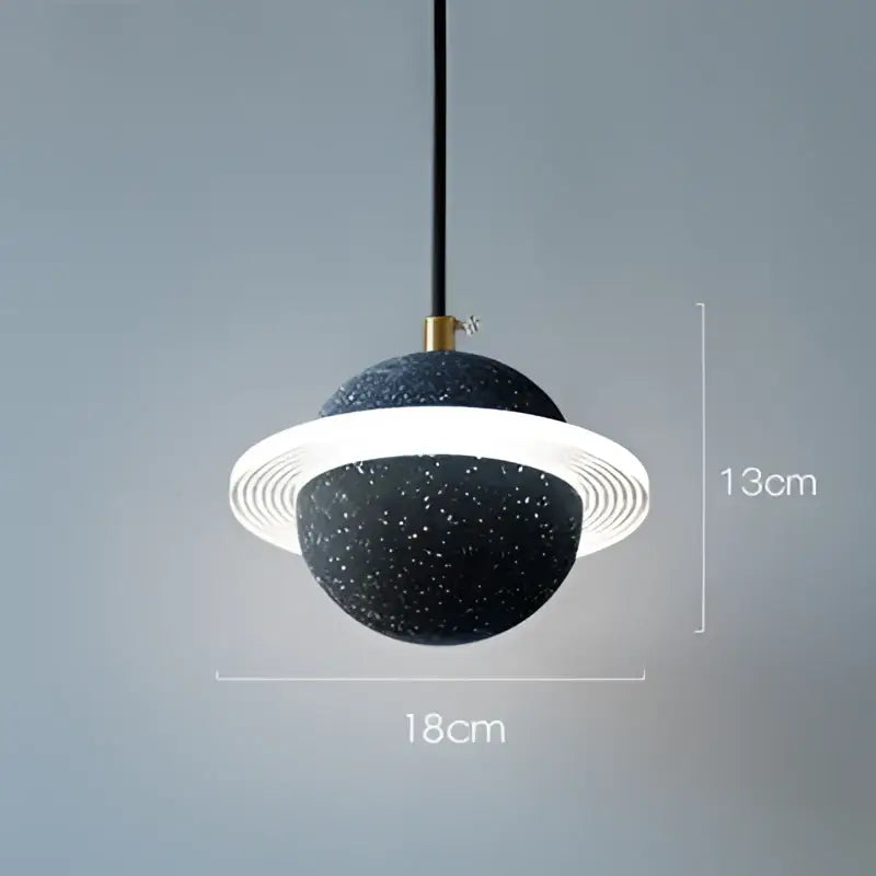 Modern gray and white decorbites cement planet pendant light glowing with black speckled planet shape for bedroom decor