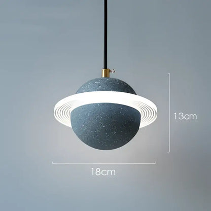 Modern gray and white cement planet pendant light with speckled spherical body and glowing ring for bedroom decorbites decor