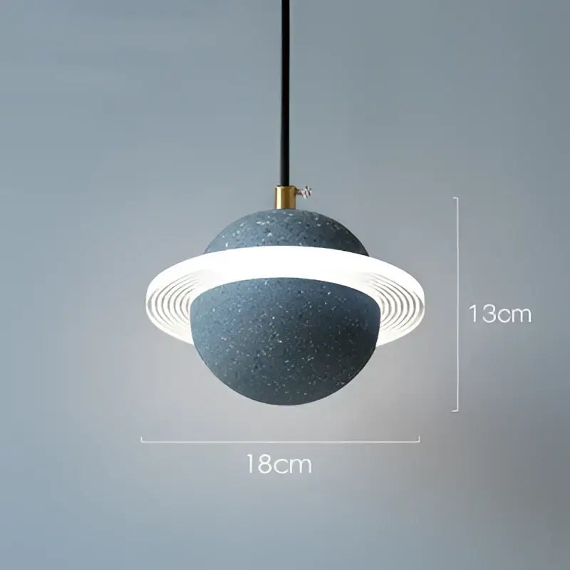 Modern gray and white cement planet pendant light with speckled spherical body and glowing ring for bedroom decorbites decor