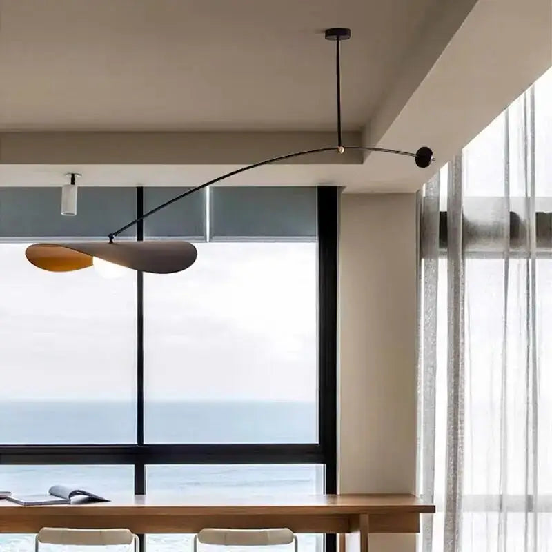 Modern black and gold sculptural adjustable led pendant chandelier with curved metal arms for dining room decorbites adjustable led