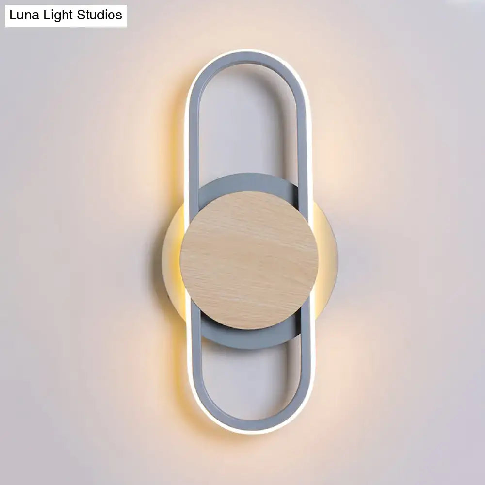 Modern gray and wood geometric led wall sconce with white light featuring a sleek minimalist circular design