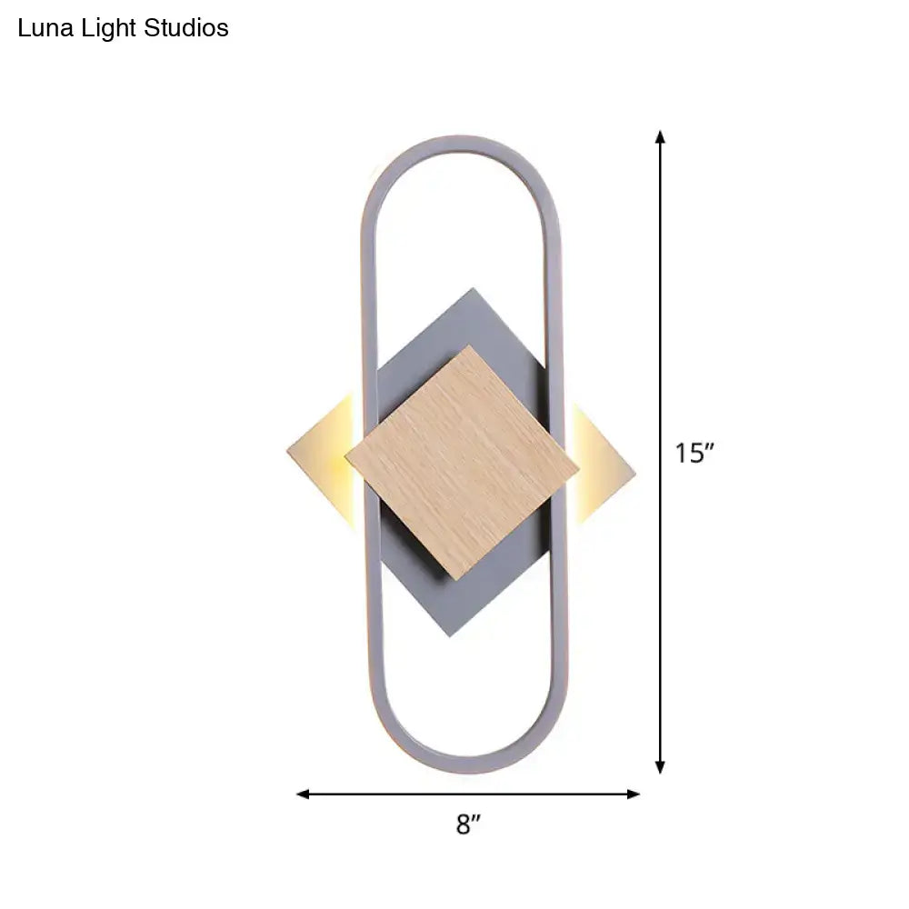 Modern gray and wood geometric led sconce with minimalist design emitting white light for bedroom lighting
