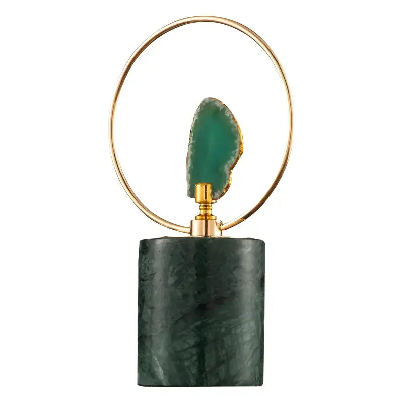 Elegant green agate crafts marble base pendant in gold circular frame displayed on dark marble base for living room art