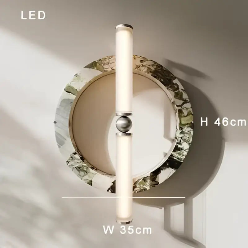 Modern wall lamp with green black marble ring and polished metallic sphere featuring vertical frosted glass led tubes