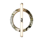 A modern wall lamp with a green black marble circular base and frosted glass tubes for bedroom use