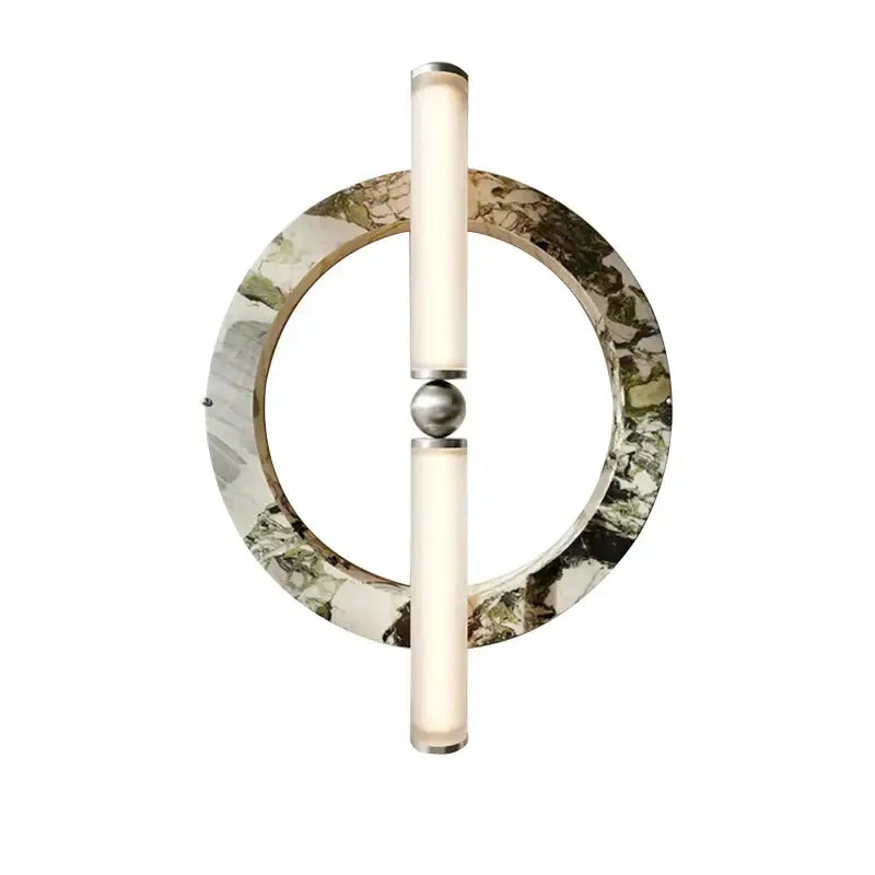 A modern wall lamp with a green black marble circular base and frosted glass tubes for bedroom use