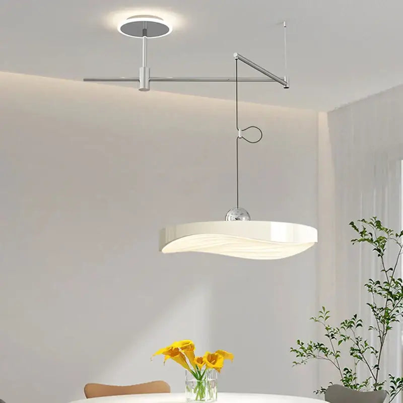 Modern white curved pendant light chandelier with sleek metallic arm and spherical connector for dining room use