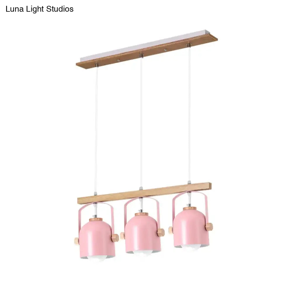 Pink metal pendant lights with wooden accents hang from a wood frame in the DecorBites™ nordic dome island light chandelier