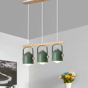 Modern green metal dome island light with wooden accents and three hanging lampshades by decorbites nordic dome island light