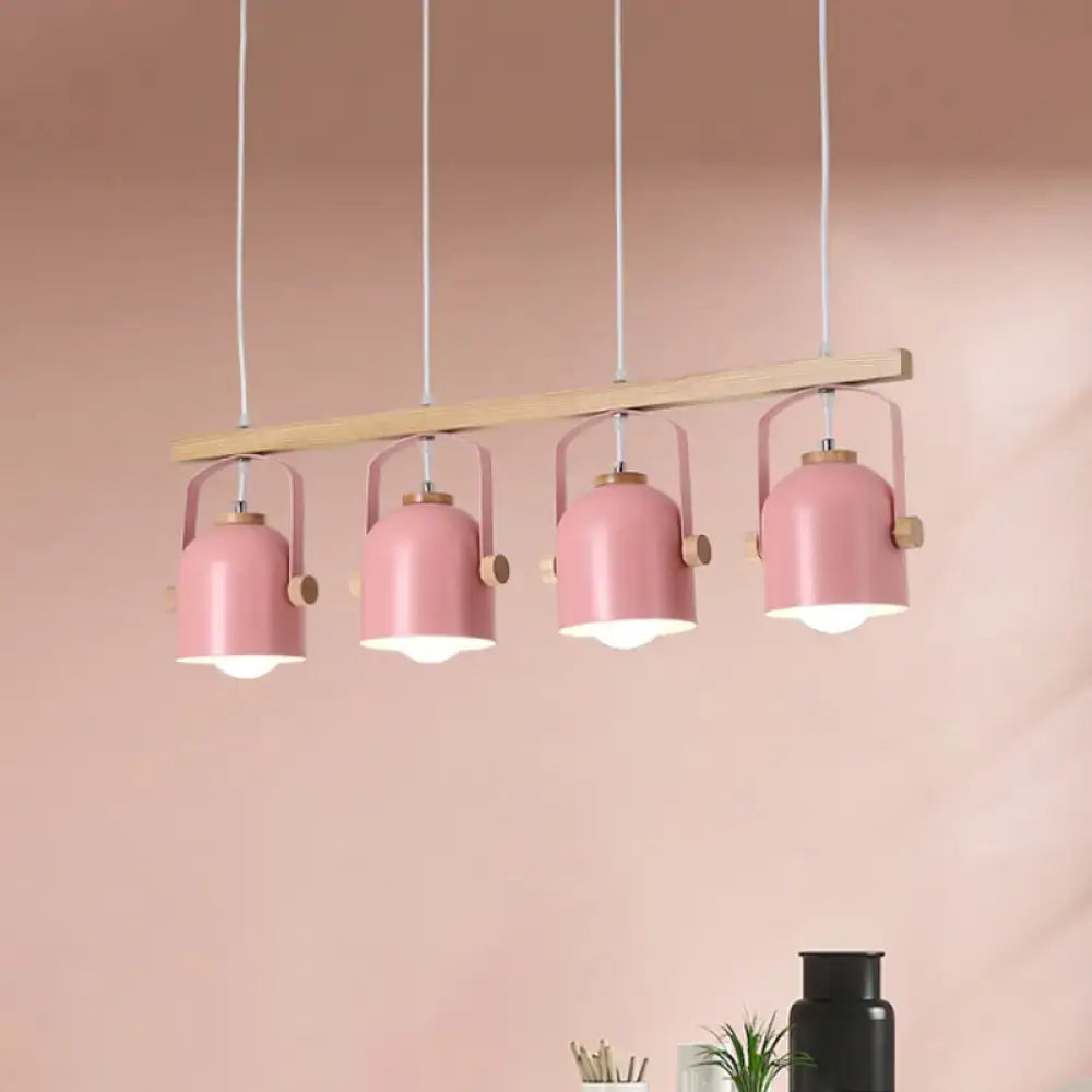 Decorbites Nordic dome island light featuring pink metal pendant shades with wooden accents on light wood bar