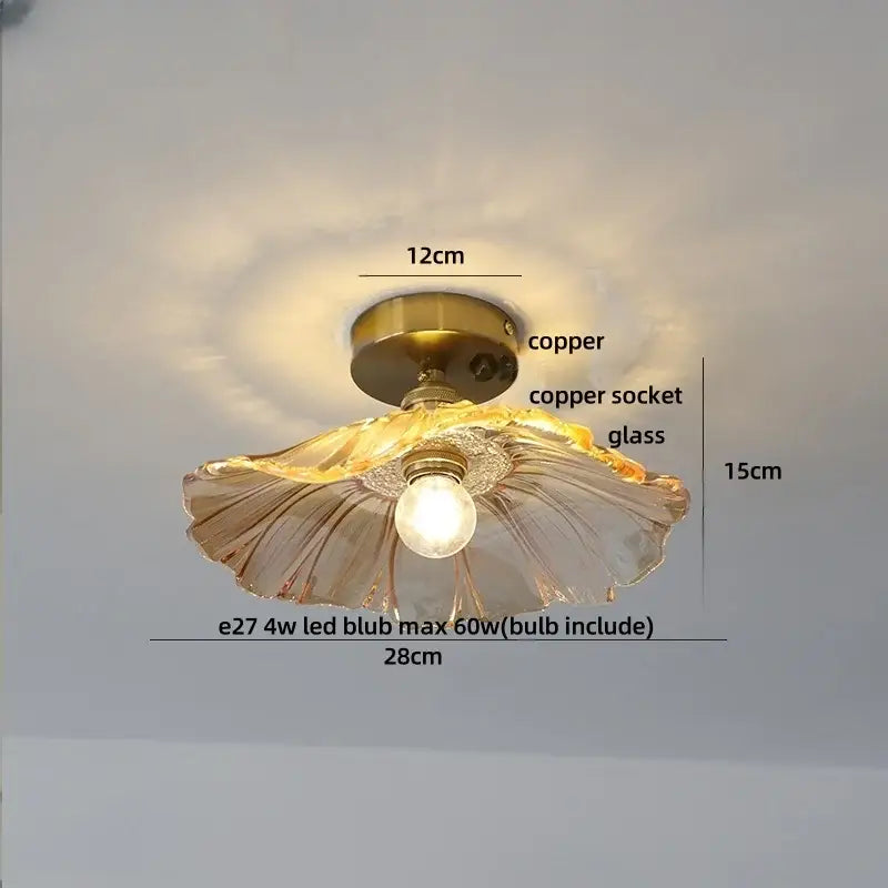 Modern green glass leaf flush mounted ceiling light with a delicate translucent fluted glass lampshade and copper hardware